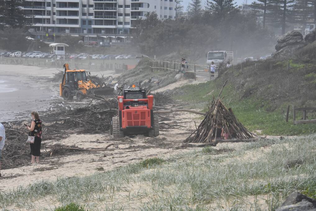 The clean-up: Toiwn Beach was a hive of activity on Wednesday, February 12, as the clean-up from the dangerous surf conditions continued.
