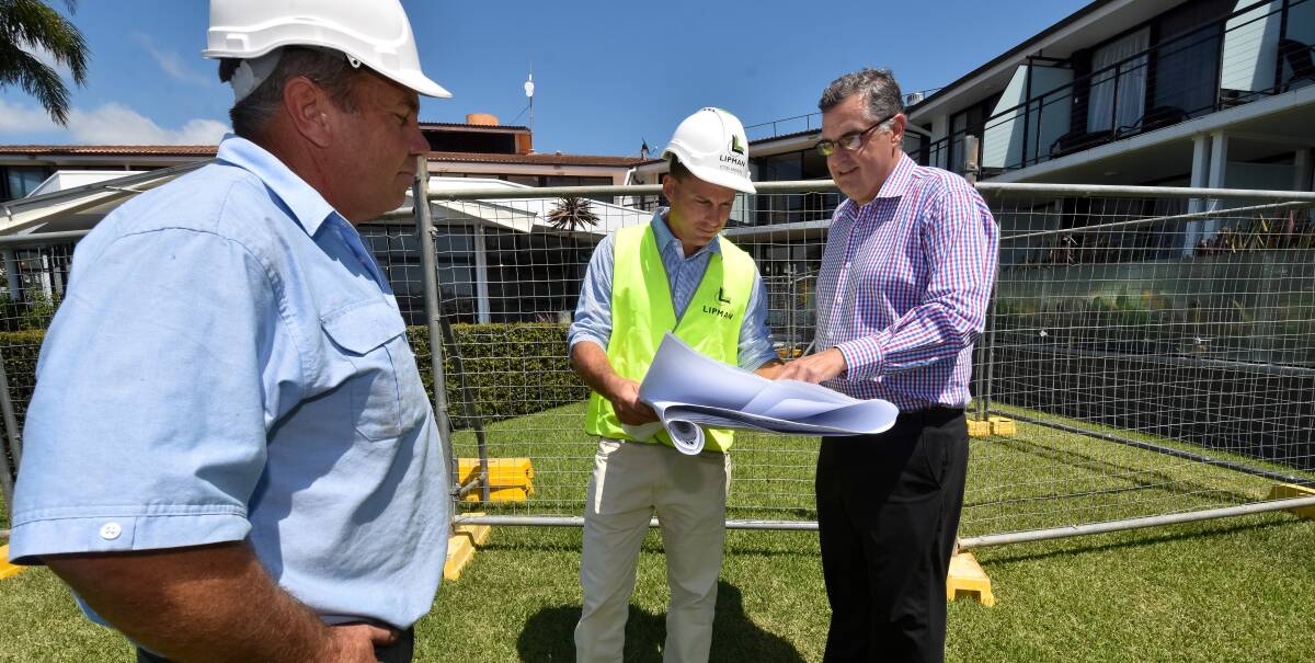Millions invested: Taphouse Facilities and Asset Manager Stewart Tonkin looks on as Lipman project manager Etzel Knorles discusses the million dollar investment at Sails Resort and Tacking Point Tavern with Justin Boydell.