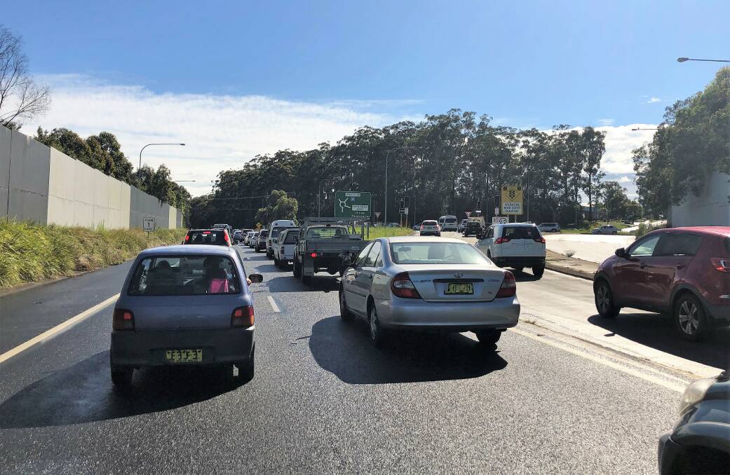 Bank on it: Traffic starts to slow as it approaches the Wrights Road roundabout on the Oxley Highway.