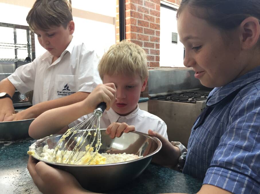 In the kitchen: Port Macquarie Adventist School's Jaydn van Leeuwen, Parker Sutherland and Chelsea Moran.