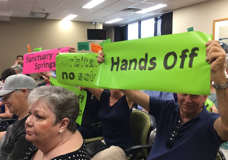Sign of the times: Residents showing their feelings over Port Macquarie-Hastings Council's plans for an orbital road investigation corridor at the December council meeting.