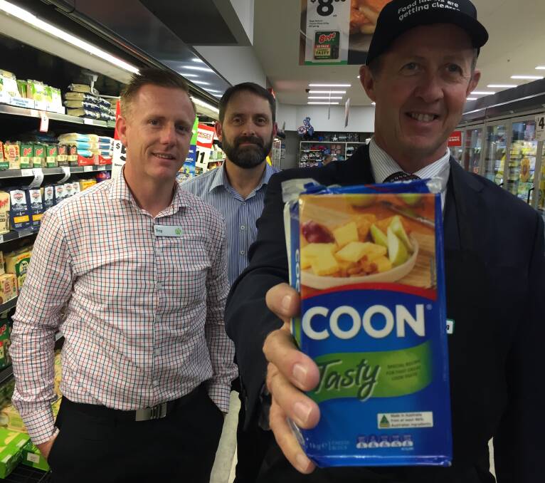 Country of origin: Woolworths' group manager Troy Pinder and Settlement City store manager Steve Parker and Cowper MP Luke Hartsuyker with an example of the new food labelling.