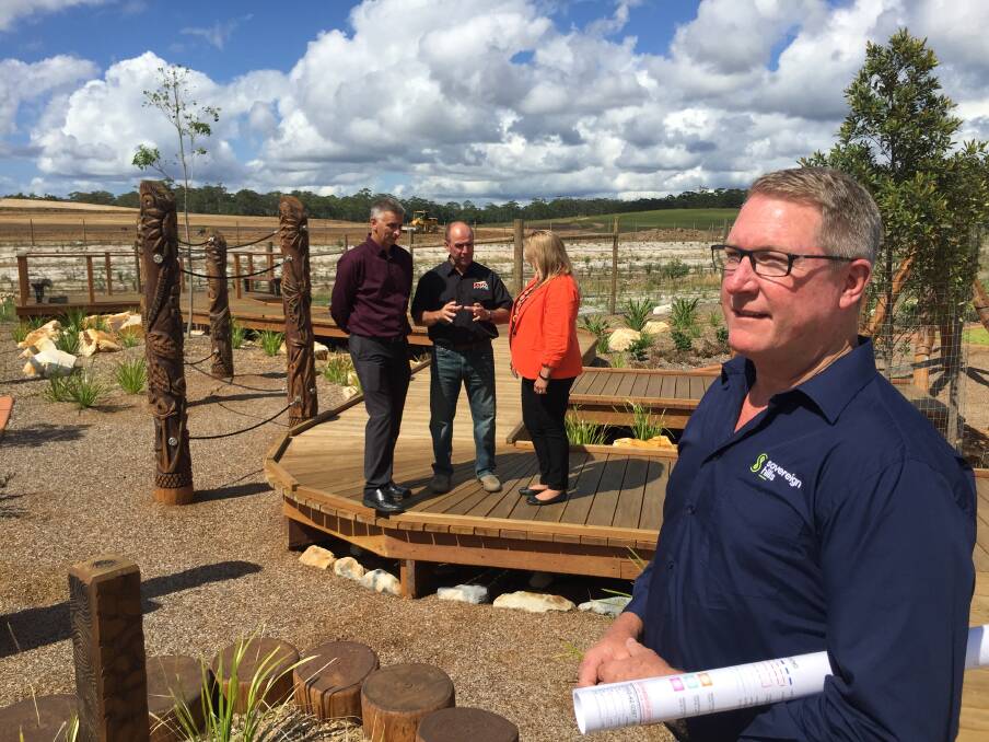 Boom times: Head of development for Lewis Land Group MIchael Long looks on as Port Macquarie Chamber of Commerce president Michael Mowle, Kazac Civil's Steve Cusato and mayor Peta Pinson discuss the latest Sovereign Hills development. Photo: Peter Daniels