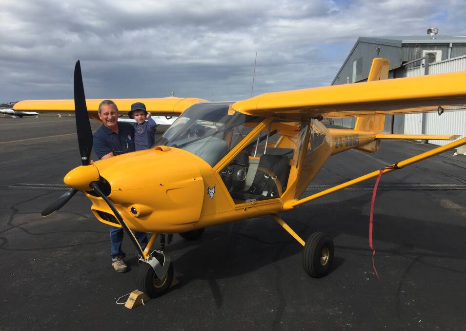 Come fly with me: Hastings District Flying Club president Rod Davison and grandson Ned Gribble with the club's Aeroprakt A22LS Foxbat training aircraft.