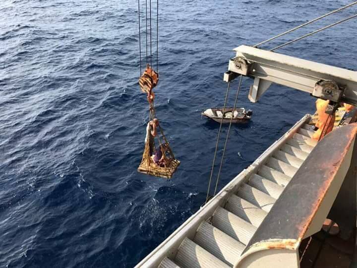 Rescued: Bryan and Merinda being winched to safety aboard a freighter in the South China Sea. Their yacht - and home for a decade - had caught fire on a trip to some remote islands.
