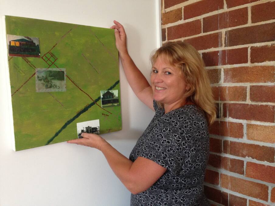 Creative seniors: Creative ageing practitioner, Lisa Hort, with an artwork by Paul DeLepervanche. One of 30 creative works that will feature in the ‘Where we call home’ exhibition at the Port Macquarie Museum for the NSW Seniors Festival. 