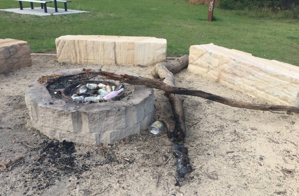 Empty alcohol bottles and cans along with large chunks of wood have been left in the two fire pits at Coal Wharf.
