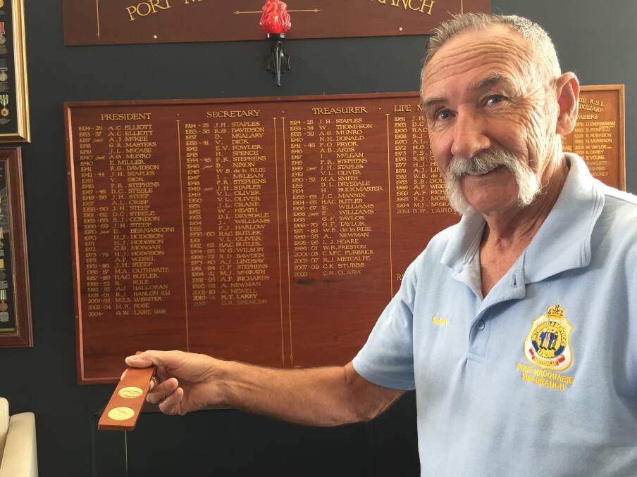 Come in spinner: Port Macquarie RSL sub branch's Gary Spencer with a two-up set that will no doubt be popular on Anzac Day.