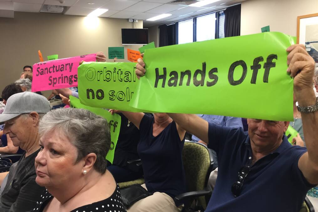 Get the message: A silent protest was held at the council meeting.