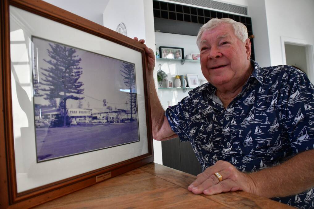 Wrong move: Bob Todd looking at a photo of the Holden dealership on Clarence Street that he purchased in 1973.