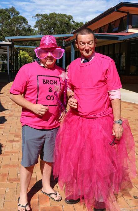 Pretty in pink: Paul Watson with Heritage Christian School Principal Geoff Brisby, getting into the PINK spirit for breast cancer research.