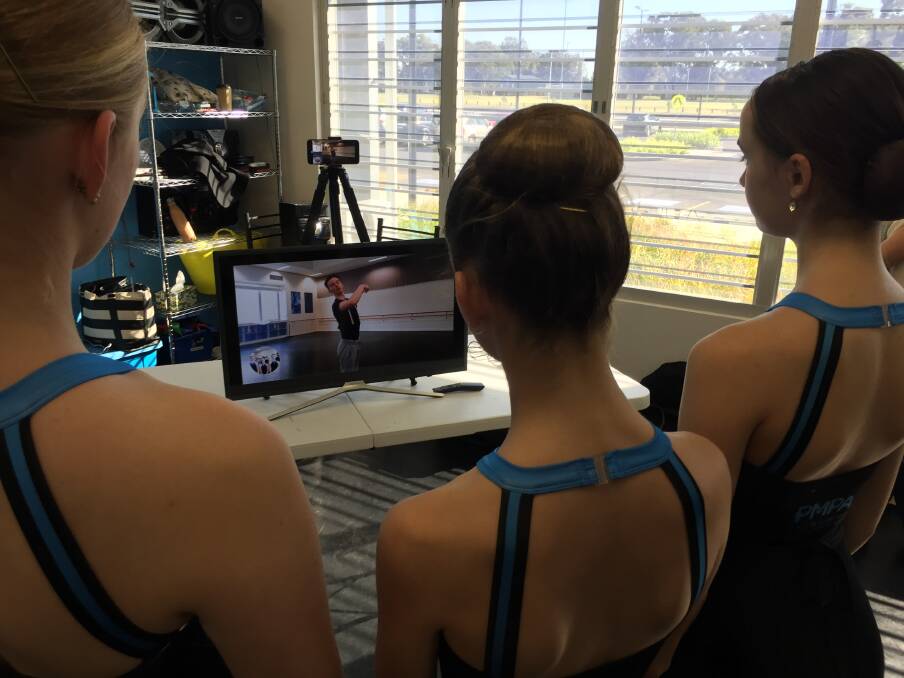 Virtual lesson: Port Macquarie Performing Arts students Lily Stace, Ashley Middleton and Melodie Cicak looking on as Australian Ballet dancer Jarryd Madden offers advice.