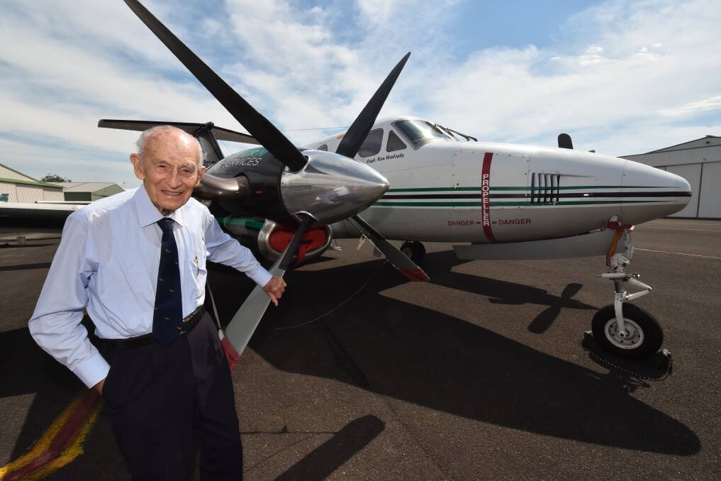 Up, up and away: Local aviation legend Ron Walesby with the Beechcraft B200 King Air named in his honour. The Eastern Air Services plane left Port Macquarie airport on December 9 for its first charter flight to Lord Howe Island.