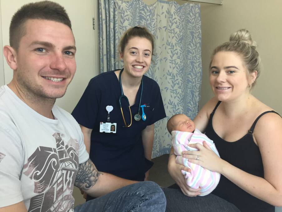 Hello Hamish: Midwife Grace Williams talking with proud parents Jesse and Lucy Wisselo. The couple's first child, a son Hamish Alexander, was born on October 24.
