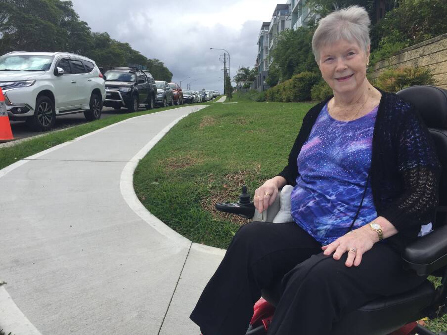 Footpath concerns: Garden Village's Carol Churchill says the footpath outside the facility is too steep and should be fixed.