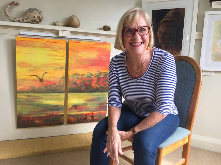 Fine art: Hastings Valley Fine Art Association publicity officer Anne Hardeman with her acrylic piece Flying Home. The association's Autumn exhibition is now on display.