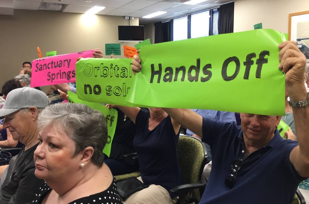 Sign of the times: Residents voicing their concerns over the planned orbital road route at the December meeting of Port Macquarie-Hastings Council.