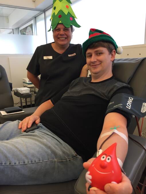 Christmas donor: Port Macquarie resident Owen Ashley and Port Macquarie Donor Centre, service officer Kelly Rees. The blood donor centre is gearing up for another busy Christmas period and is calling for more blood donations.