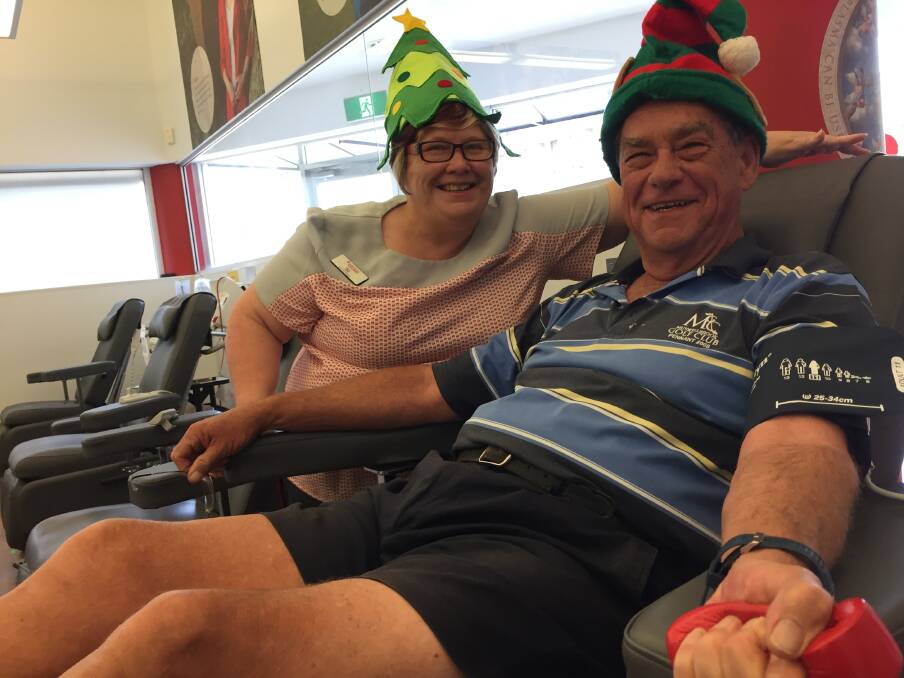 Milestone donation: South West Rocks resident Des Goodworth with Port Macquarie Donor Centre manager Liz Matson. Mr Goodworth is making his 30th donation in preparation for the busy Christmas period.
