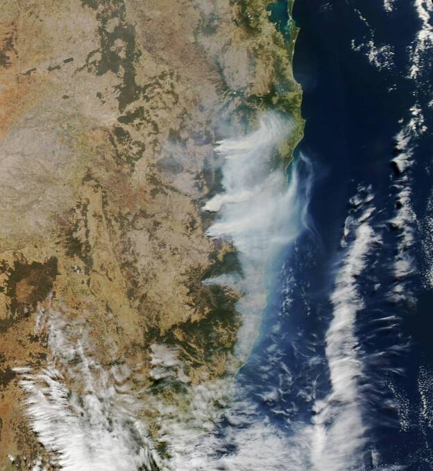 This satellite photo shows smoke from the bush fires including the Bees Nest blaze near Ebor through to the Port Macquarie-Hastings.