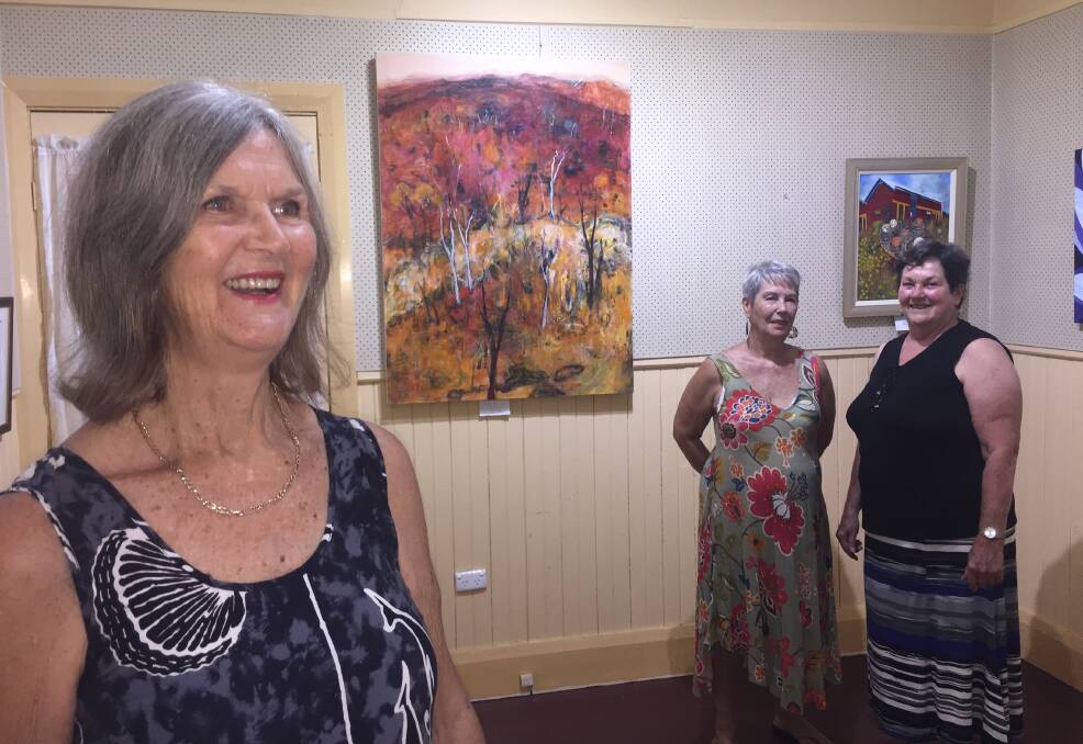 Art works: Art teacher Judy Jelsma and Lesley Sargent and Kerry Wheeldon are preparing their art pieces for the annual Port Macquarie Art Society end-of-year exhibition which opens on Wednesday November 27.