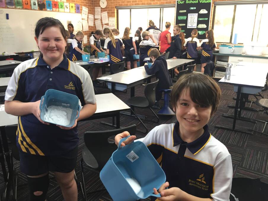Bath bombs: Port Macquarie Adventist School's Lola Willows and Lewis Eddenmoore preparing the ingredients for their bath bombs. The items will be sold at the school's inaugural spring fair on Sunday September 22.