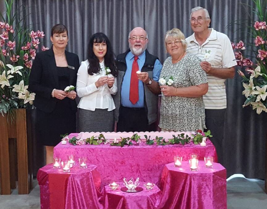 Remembrance: Kylie Lyons, Debbie Hesse, Kerry Medway, and Jan and Ross Packer with special candles to be lit in memory of mothers and grandmothers.