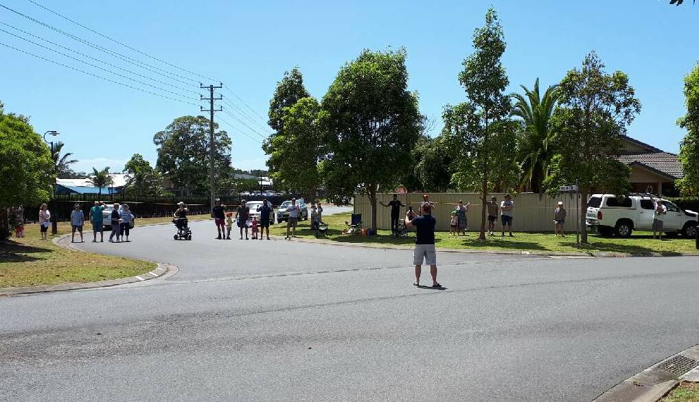 Measuring up: Members of the Lake Innes Orbital Road Action Group step out the width the road could have on their community.