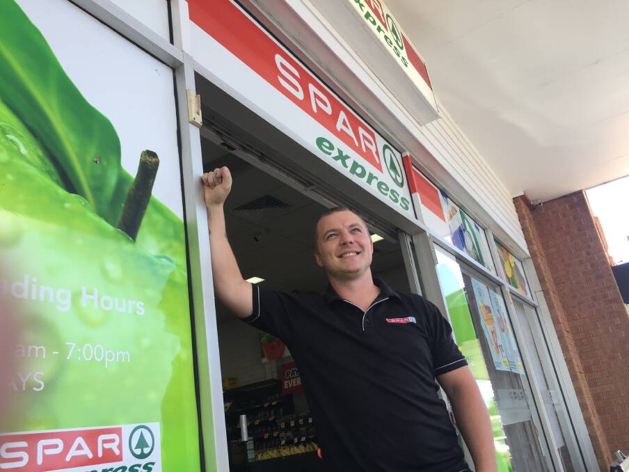 Strange times: Zac Petterson from Spar Express at Clifton Shopping Complex.