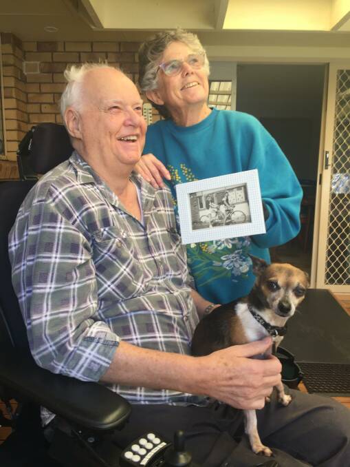IMPORTANT BIRTHDAY: Graham and Betty Frost with Toby the rescue dog and a photo of Graham's parents.