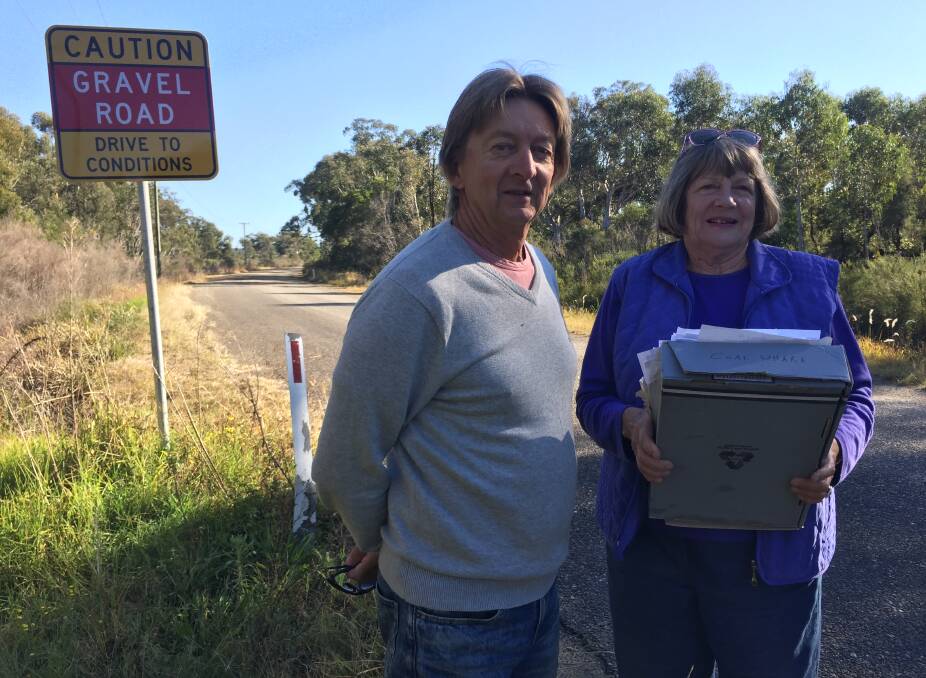 Here's hoping: Northside Progress Association president Kingsley Searle and secretary Narelle Milligan are ecstatic with moves to source funding to tar the contentious Maria River Road.