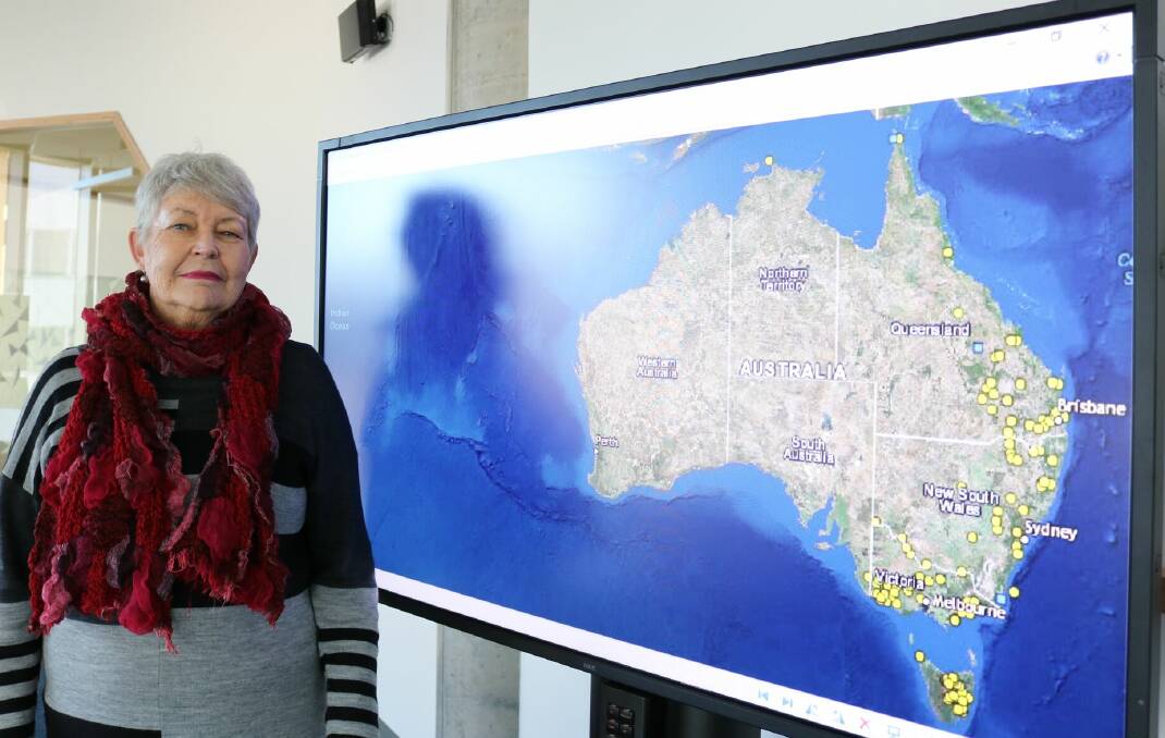 Mapping massacres: Professor Lyndall Ryan with a map of known colonial frontier massacres. Pic: Supplied