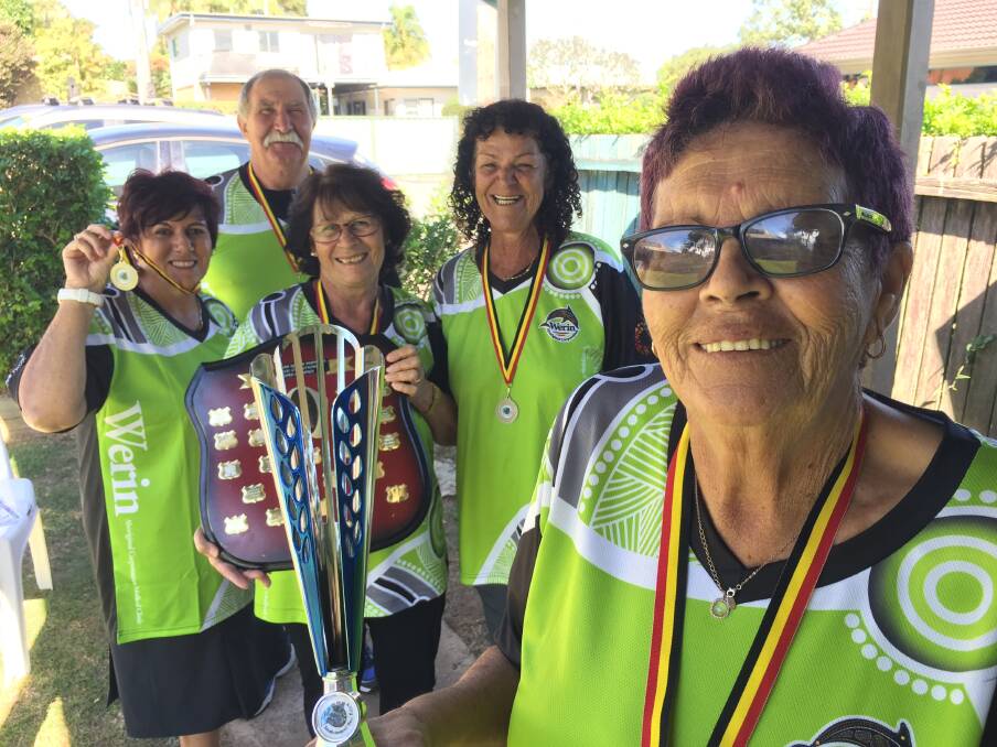 Elders Olympic gold: Aunty Marian Holten proudly holds the winning Elders Olympic Cup as fellow gold medal winning team members Cindy O'Brien, Gloria O'Brien-Rudyk, Rudy and Reta Latimore look on. Photo: Peter Daniels