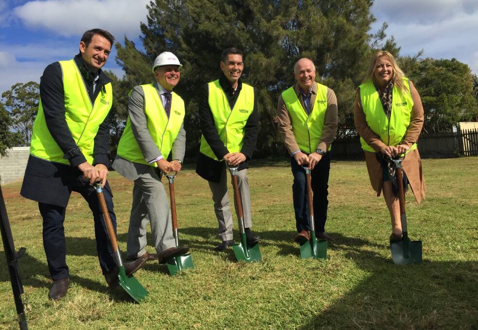 Sod turning: Luke Morris from Morr Homes and Projects, Uniting's director property and housing Simon Furness, Uniting's head of property and development Adrian Ciano, Rev Malcolm Hausler and mayor Peta Pinson at the sod turning ceremony on Tuesday.