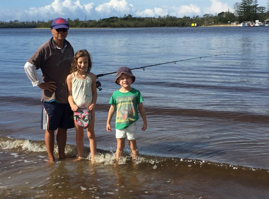 Fishing fans: Sydney's Scarlet and Charlie Zdun with grandfather Bob Long dropping a line on the North Shore on Thursday, April 2.