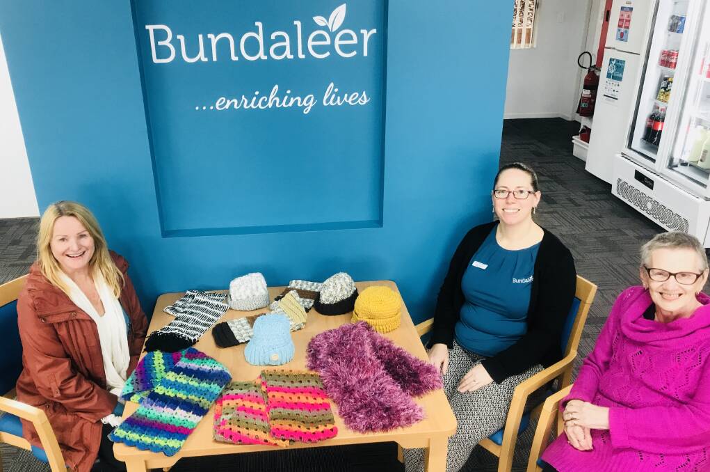 Warm the heart: Bundaleer craft group is providing hand knitted woollies to people in need in project warm Wauchope. From left Regina Evans, Bundaleer’s Sheree Cheetham and Maree Carrington. Photo: supplied