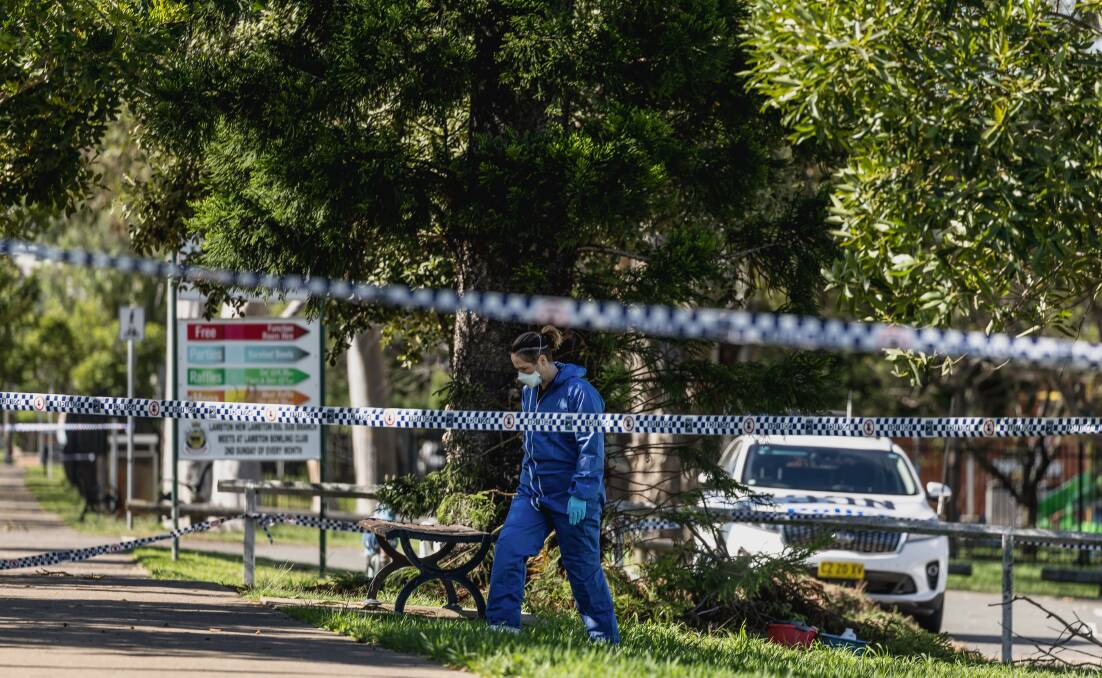 Police at the crime scene in Karoola Road, Lambton on Friday. Picture by Marina Neil 