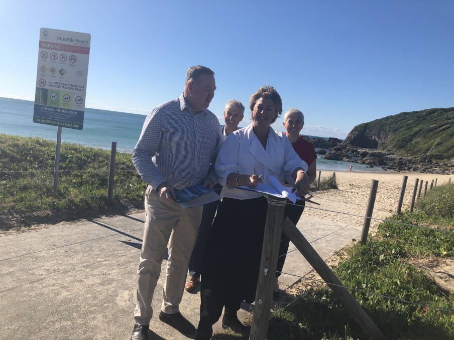 Minister for Water, Property and Housing, Melinda Pavey signs the historic document at One Mile Beach, Forster while local member, Stephen Bromhead, Crown Land Commissioner, Prof Richard Bush and Crown Land deputy secretary, Melanie Hawyes look on.