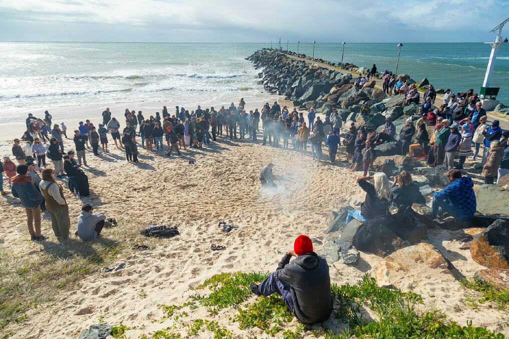 Members of the surfing and wider community came together late last month for a healing and smoking ceremony at Tuncurry after a tragic shark attack claimed the life of a surfer in May.