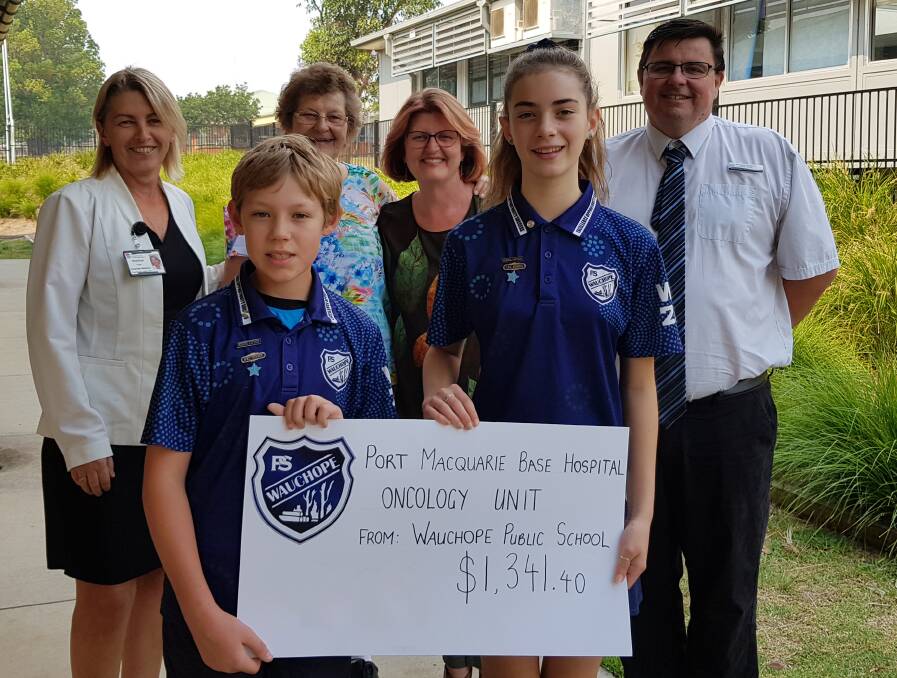GENEROUS: (front) Wauchope Public School captains Dylan Taylor and Tiana Daly, (back) MNC Cancer Institute rep Sharon Fuller, organisers Heather Innes and Lynn McWhirter, Assistant Principal Richard Thomas.