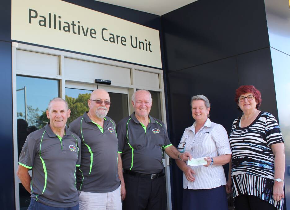 REMEMBERING A FRIEND: Bonny Hills Beach Hotel Social Golf Club treasurer Ted Davis, secretary Paul Potts and president Tony Carroll present their donation in memory of Mick Kennedy to Nursing Unit Manager Mary Trotter and Nurse Manager Yvonne Carmichael.