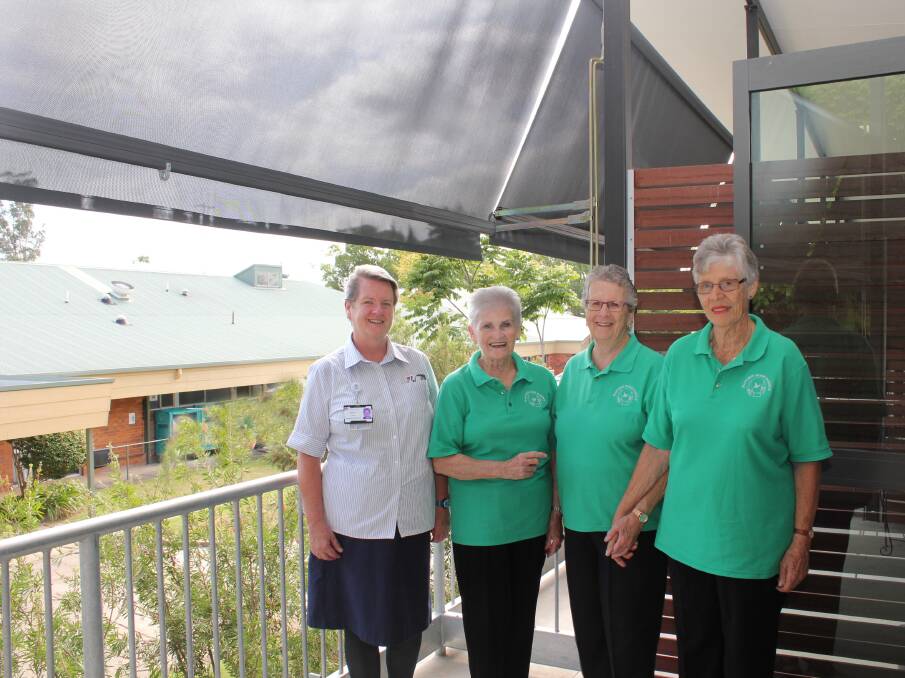 New shade awnings: Palliative Care nursing unit manager Mary Trotter and Hastings Home Hospice representatives, Alice Barry, President Lil Andrews and Jan Fox on one of the protected balconies.
