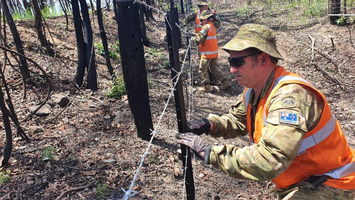 Aussie soldiers help BlazeAid rebuild fences around the Hastings