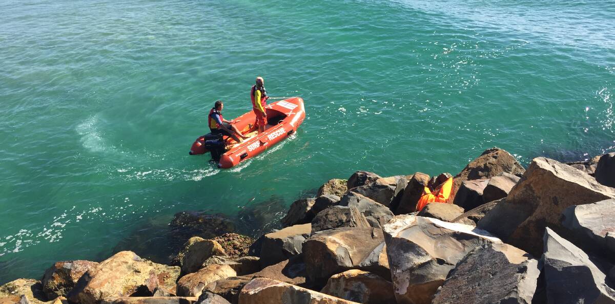 SIMULATED RESCUE ON THE ROCKS AT NORTH HAVEN BEACH.