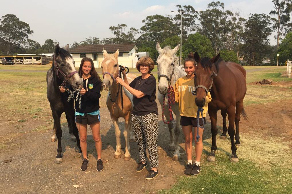 GLAD OF SHELTER: Nicola, Maxine and Hannah Abi-Saab were grateful to be able to take their six horses and three alpacas to Wauchope Showground. Photo: Letitia Fitzpatrick.