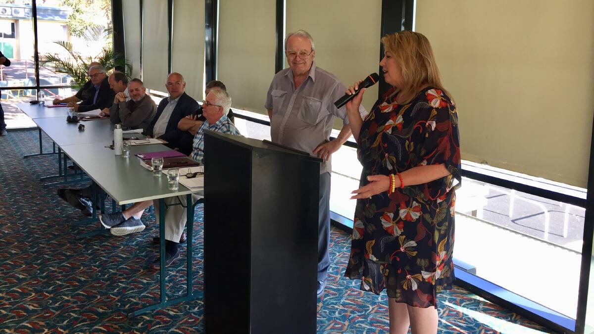 SUPPORT: Mayor Peta Pinson addresses the anti-orbital road meeting at the racecourse, chaired by John Tingle (left).