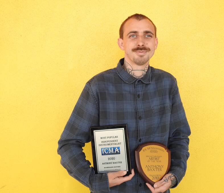 STAR PERFORMER: Anthony Baxter, the Wauchope-based guitarist, with his latest awards.