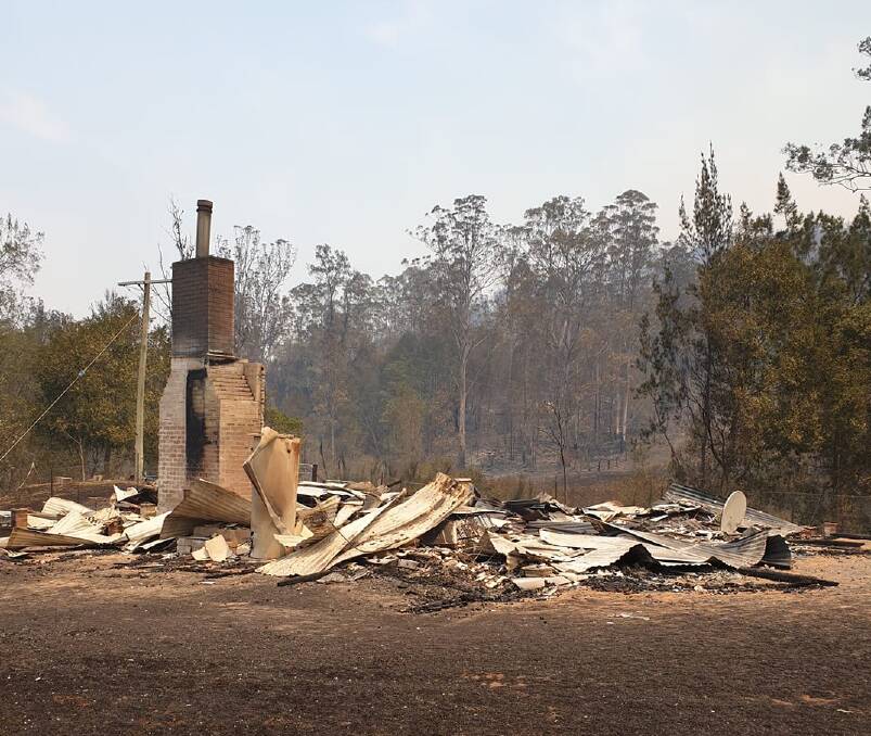 The charred remains of a home destroyed by fire in Upper Pappinbarra at the weekend.