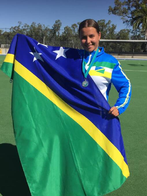 CELEBRATING SILVER SUCCESS: Indy Howell, who is a member of Wauchope Hockey Club, celebrates helping Solomon Islands win silver at the Oceania Cup. Photo supplied.