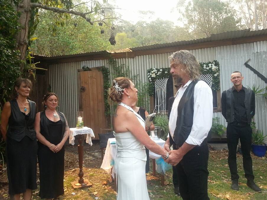 A YEAR IN THE PLANNING: Christine and Mick say 'I do', despite the bushfires.